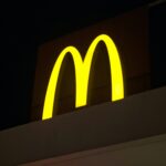 a yellow logo on a wall